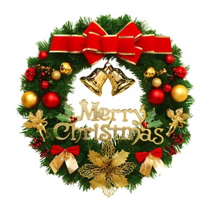 Classic Christmas wreath with pine needles, gold bells and red bows on white background