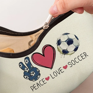 Canvas travel makeup bag featuring Peace Love Soccer print with black zipper closure
