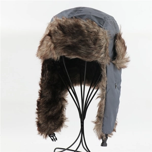 Close-up of grey windproof trapper hat with soft brown faux fur lining and buckle