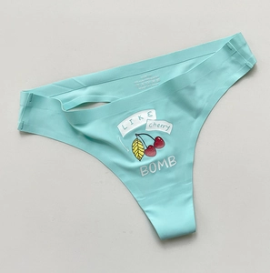 Detail of light blue seamless thong featuring cartoon cherry pattern and soft ice silk fabric