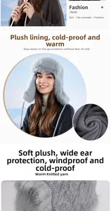 Detail of plush lining and windproof earflaps on gray winter faux fur trapper hat