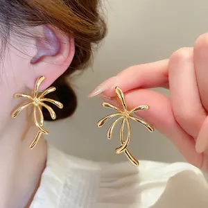 Abstract golden flower stud earrings with a bold radial leaf design for women