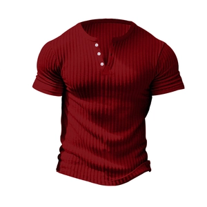 Close-up of burgundy ribbed fabric and V-neck Henley collar with three white buttons