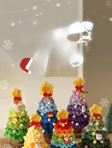 Detailed view of handmade crochet Christmas trees with colorful ornaments and mini bells