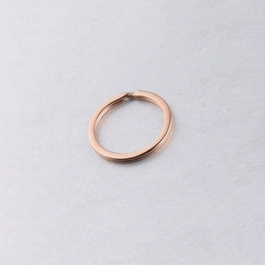 Close-up of a 25mm rose gold flat stainless steel split key ring for DIY accessories