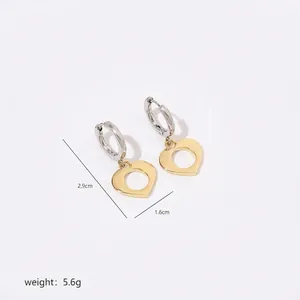 Detailed view of two-tone heart drop earrings with dimensions 2.9cm height and 1.6cm width