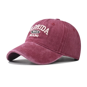 Close-up of vintage washed burgundy baseball cap with Florida 1822 Miami embroidery