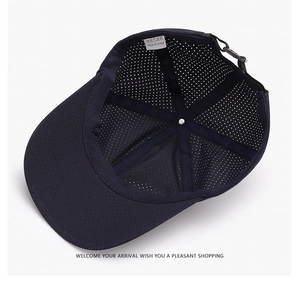 Detail of dark blue mesh baseball cap showing breathable texture and adjustable back strap