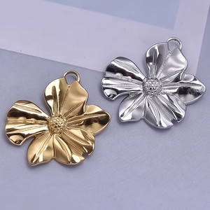 Detail of 304 stainless steel flower pendants in gold and silver with petal texture