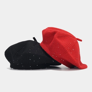 Sparkly sequin knit beret hats in black and red colors with classic top tip detail