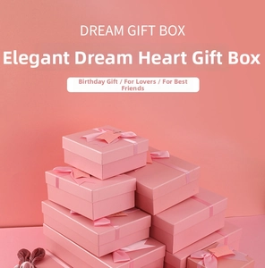 Stack of pink gift boxes with satin ribbons and Dream Gift Box tags in a monochrome set