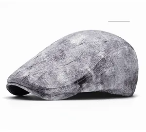 Detail view of American tie-dye beret with stone-wash texture and retro gray fabric pattern