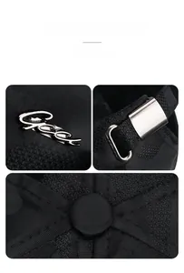 Detailed view of the silver Gees metal logo and adjustable buckle on black camo hat