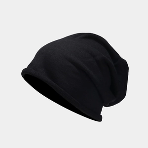 Close-up of the fine knit texture and rolled edge design on this black beanie cap