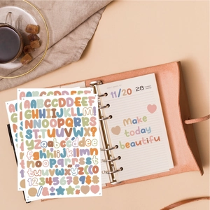 Flat lay view of colorful 0.5 inch alphabet stickers for scrapbooking and journal decor