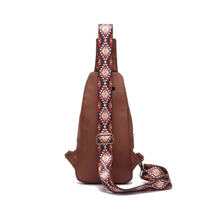 Detail of bohemian Aztec patterned strap on brown crossbody chest bag for women