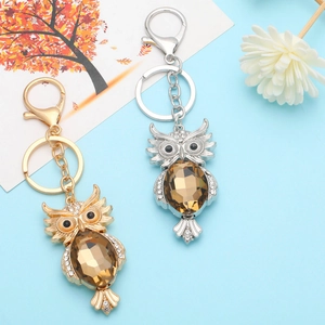 Fashionable owl metal keychains with amber rhinestones in gold and silver finishes
