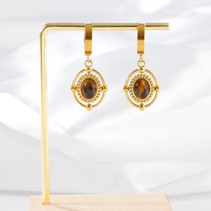 Vintage gold stainless steel earrings with oval tiger eye stone in professional display