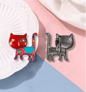 Detailed front and back view of a cute red enamel cat brooch with floral heart pattern
