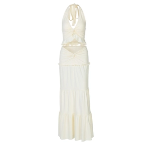 Detail of the cream-white tiered maxi skirt with elegant ruffles and layered structure