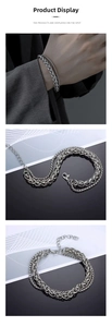 Detail of silver double-layered dragon bone chain bracelet with lobster clasp and texture