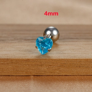 Macro shot of 4mm heart-shaped blue zircon stud earring with polished silver base