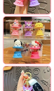 Detailed view of Sanrio character keychains featuring LED base and golden metal rings