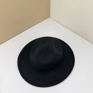Top-down view of a classic black wool fedora hat with a wide brim and teardrop crown