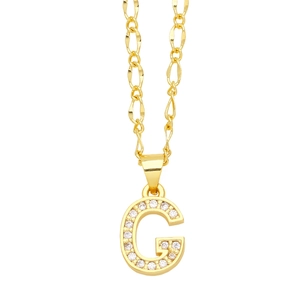 Macro shot of gold-plated G-letter pendant encrusted with pavé cubic zirconia