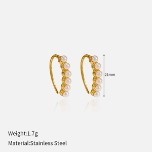 Macro view of gold stainless steel hoop earrings with faux pearls and size dimensions