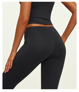 Detailed back view showing lifting effect and high-waisted design of black yoga pants
