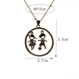 Detail of gold boy and girl pendant necklace with specific 3.5cm by 2.7cm measurements