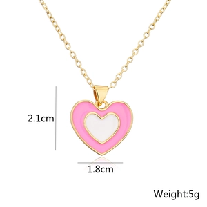 Detail view of 18K gold-plated heart pendant with dimensions 2.1cm and 5g weight