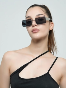 Close-up of retro rectangular metal sunglasses featuring silver temples on male model