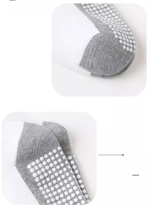 Detail of baby anti-slip socks showing reinforced toe seams and grip texture dots