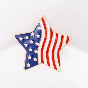 Star-shaped American flag brooch in red white and blue enamel with a gold metal finish