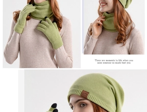 Detailed view of green knitted winter set with touch-screen gloves and sport logo beanie