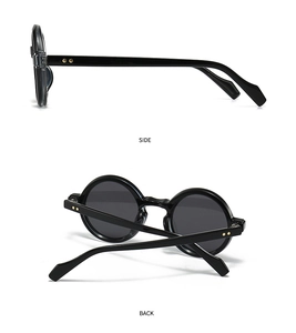 Detail view of black vintage round sunglasses with gold rivets on side and back