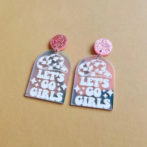 Pink glitter stud earrings with acrylic arch charm and Let's Go Girls cowboy hat text