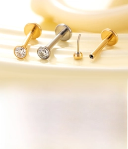 Macro detail of G23 titanium labret stud with zircon inlay and 1.2x8mm flat base bar