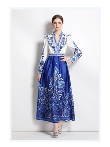 Detail of elegant V-neck floral maxi dress with button-up front and silky satin finish