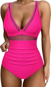Detail of hot pink one-piece swimsuit with black mesh panels and slimming pleated waist