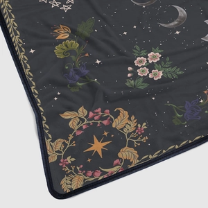 Dark grey flannel blanket featuring moon and stars patterns with high-quality hemmed edges