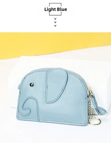 Detail view of light blue leather elephant coin purse with pebble grain and gold keychain