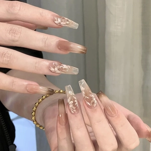 Brown gradient long coffin press-on nails with white flower patterns and glitter