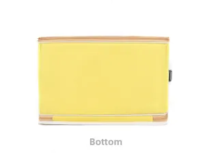 Detailed bottom view of yellow pet carrier bag with durable nylon material and zippers