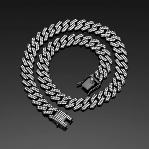 Macro view of 14mm black rhombic Cuban chain with pavé diamonds and box clasp detail