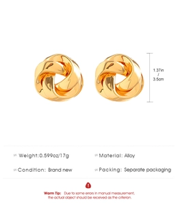 Detailed view of polished gold alloy twisted knot earrings with size and weight specs