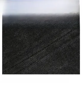 Close-up of black washed fabric detail with twill texture and neat stitching on ivy cap