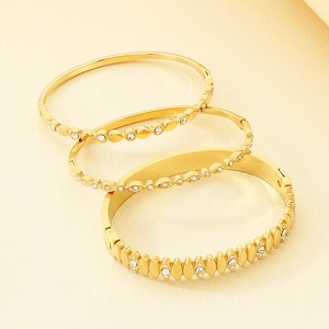 Elegant 18K gold plated stainless steel bangles set with white zircon stones
